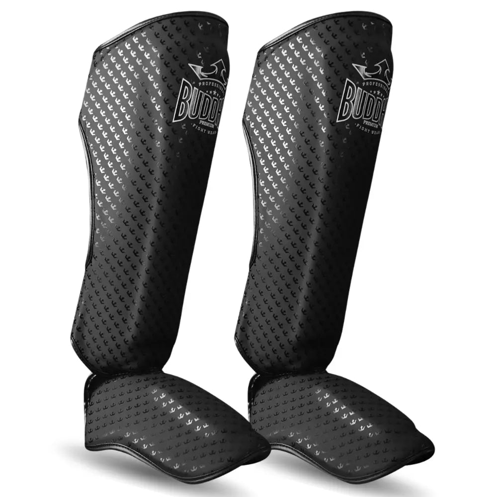Caneleiras de Kickboxing e Muay Thai BUDDHA Titanium, pretas mate, proteção extra nas canelas, vista de lado