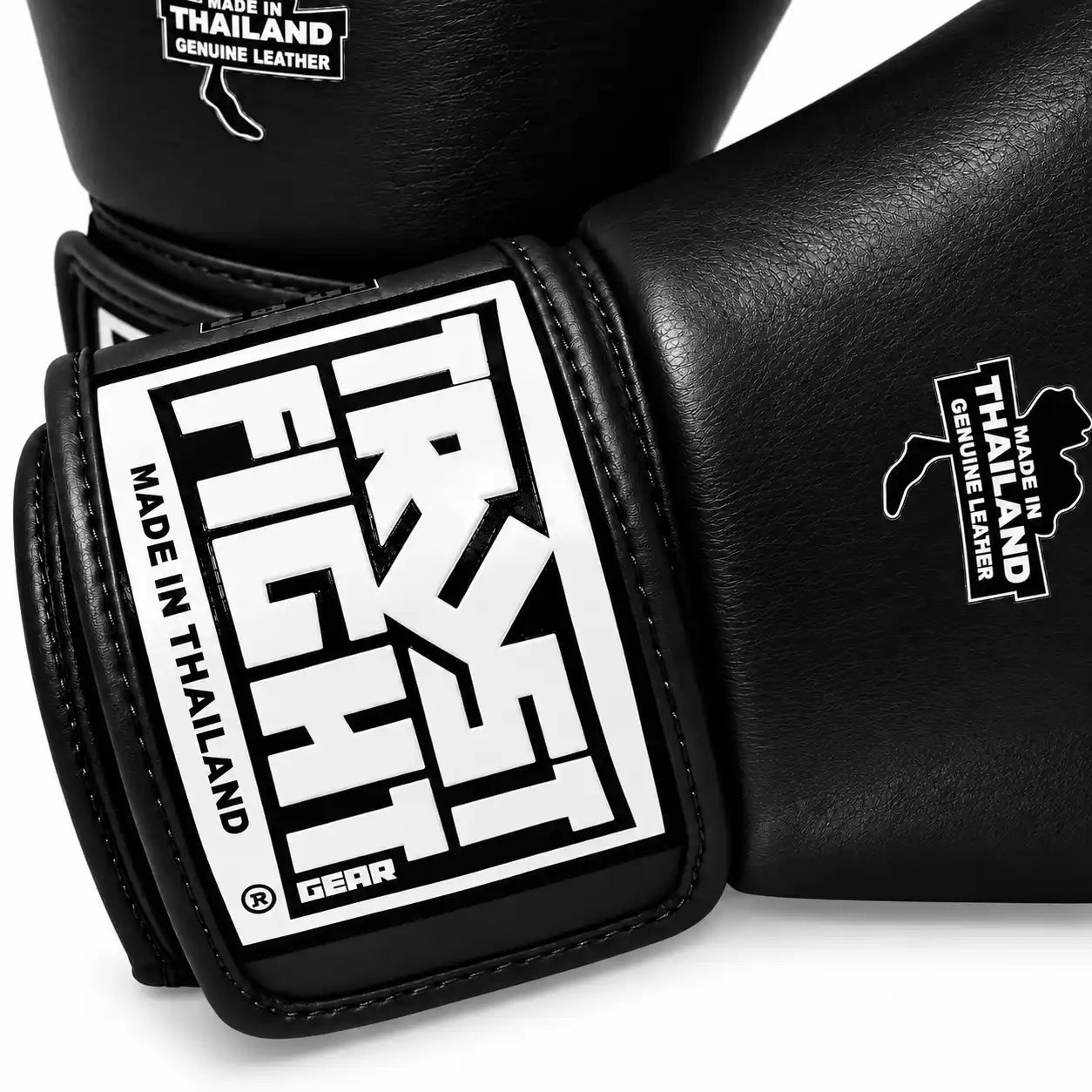 Luvas TRUST Icon pretas de pele para kickboxing, detalhe do verlcro e selo de qualidade. Luvas fabricadas na Tailândia.